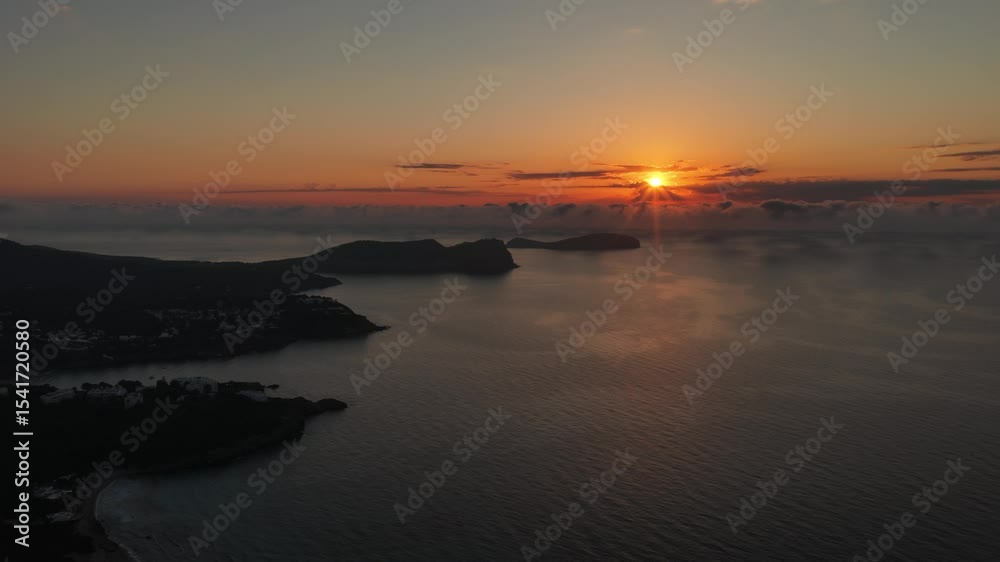 Beautiful sunrise over the sea near Santa Eulària des Riu and Es Canar, Ibiza, Spain Beautiful sunrise over the sea near Santa Eulària des Riu and Es Canar, Ibiza, Spain