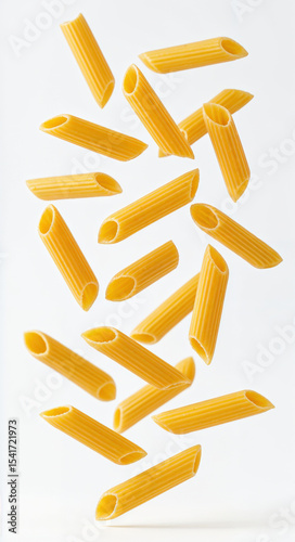 Floating penne pasta pieces isolated on white background in mid air for creative food concept and motion design
