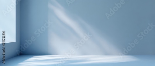 The serene blue interior with soft shadows and light reflections.