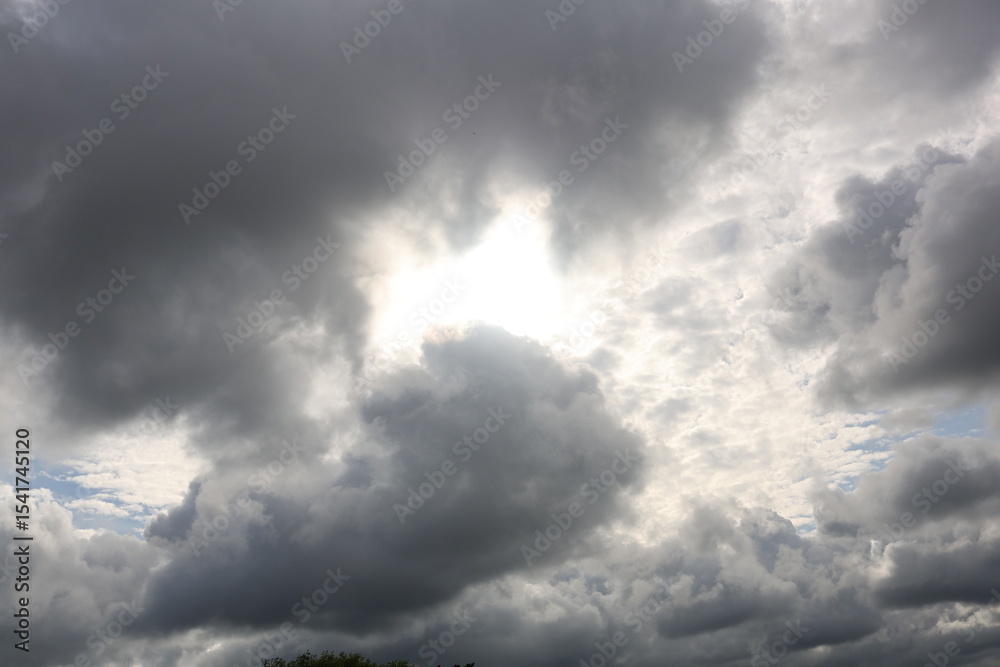 Fototapeta premium dark clouds with sun in the sky