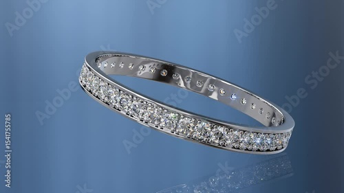 Pavé  set eternity ring with tiny diamonds rolling on blue glossy background. Seamless loop 3D animation.
