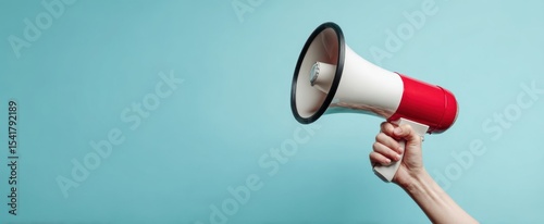 The megaphone held aloft for clear communication in a vibrant setting.