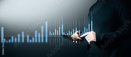 hand of businessman interactive touching a holographic of transaction financial network data system, concept of technology artificial intelligence with human user application