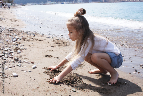 little cute girl on beach, lifestyle people concept