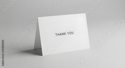 Minimalist thank you card displayed on a neutral background.