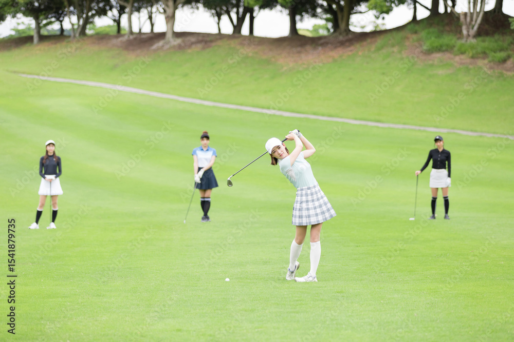 Obraz premium ゴルフを楽しむ女性