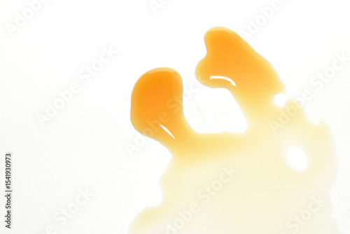 Shapeless pile of cough syrup on white background.