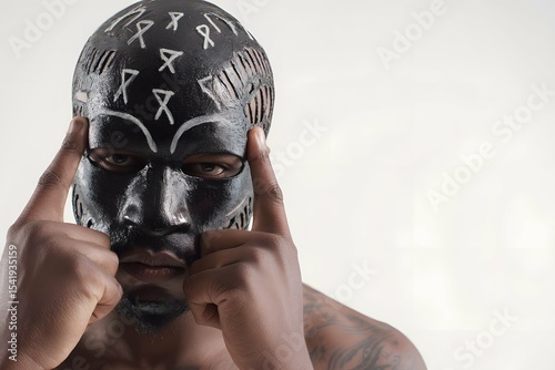 A masked actor exposing prejudice—it’s a spotlight on societal shadows.
