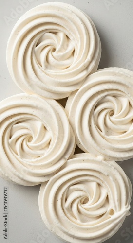 Four Off White Swirled Meringue Cookies Close Up dessert