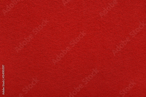 Red felt texture background - close-up of soft fabric surface. Seamless background, graphic design, scrapbooking, textile layouts, creative projects.