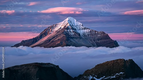 Misty Highland Valley Sunrise: Aerial View of Rolling Hills and Peaks