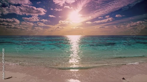 Vibrant beach sunset with colorful sky and sunlight reflecting over calm turquoise ocean, tropical shoreline perfect for travel, relaxation, and summer vacation visuals