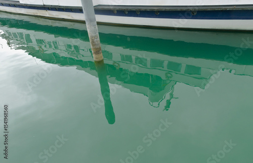 reflection of a ferry in the turquoise water photo
