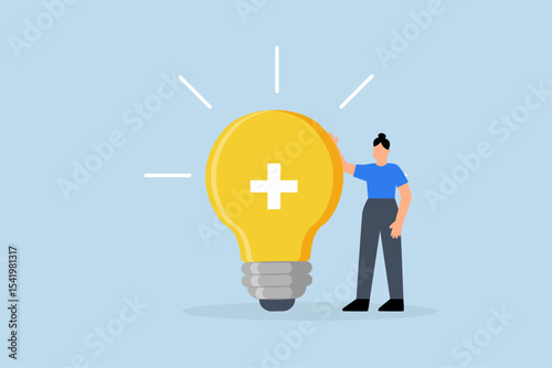 Positive thinking, businesswoman positioned with glowing light bulb concept featuring optimistic symbol.