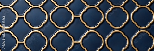 Elegant dark blue tiles with gold trim form a repeating quatrefoil pattern, creating a luxurious and sophisticated textured surface.