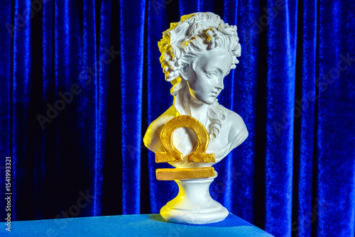 Wallpaper Mural A female plaster bust with the golden sign of Libra on the background of blue velvet curtains still life. Torontodigital.ca