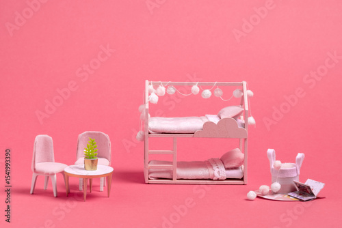 Wallpaper Mural Miniature pink dollhouse bedroom with bunk bed, chairs, table, and decor. Cozy and stylish tiny interior on pink background. Torontodigital.ca