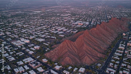 Cityscape and Mountain View: An aerial perspective showcases a vibrant cityscape intertwined with majestic mountains.