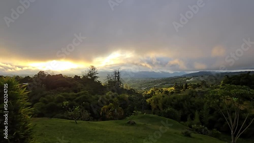 Time lapse of scenic landscape in El Carmen, Valle del Cauca, Colombia with dramatic moving clouds, changing natural light, rural mountains, lush greenery and serene Andean countryside views