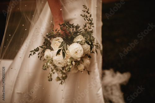 Bouquet under a wedding veil
