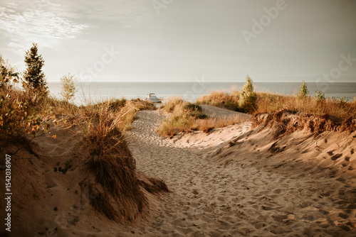 Sand dunes at the lake at sunset