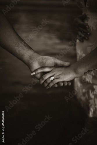 black and white hands holding