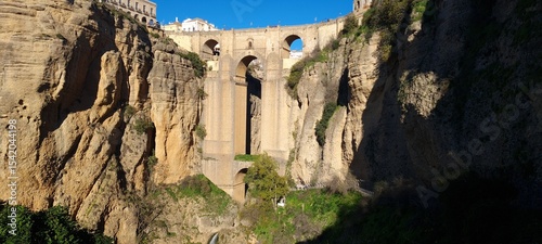 Beautiful old stone bridge at sunset. Useful street in the old town. Scenic view from the path in the mountains. European landmark for sightseeing. Must-see grand canyon national park.
