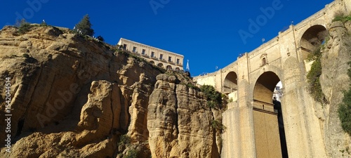 Beautiful old stone bridge at sunset. Useful street in the old town. Scenic view from the path in the mountains. European landmark for sightseeing. Must-see grand canyon national park.