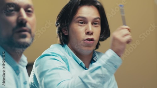 Smiling Young Employee Receiving Encouragement from Colleague