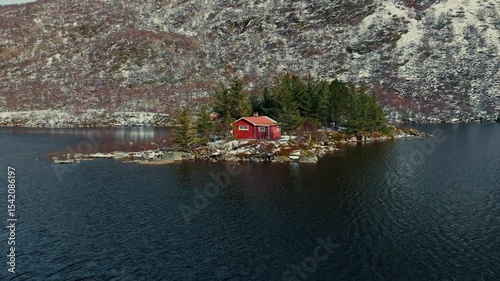 Quaint and Scenic Island Cabin Nestled in Stunning Autumn Landscapes with a Mountain Backdrop