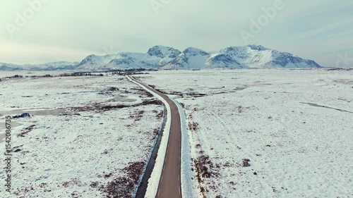 A Serene, Majestic Snowy Landscape Featuring an Endless Road for Exploration and Adventure