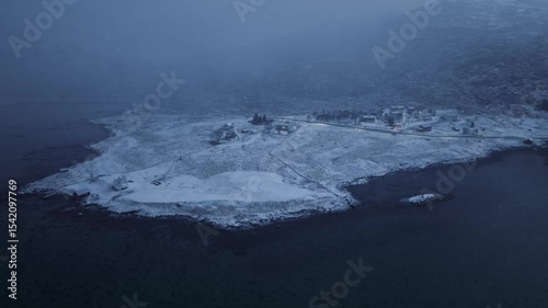 A Beautiful Snowy Coastal Landscape Viewed Under Foggy and Mysterious Atmospheric Conditions