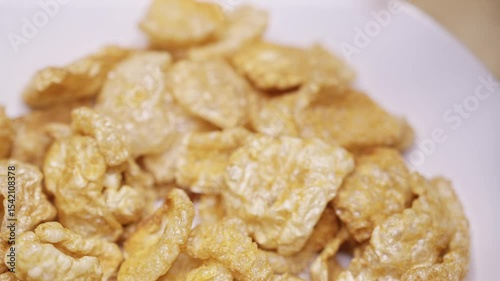 Pork rinds grabbed from bowl to be eaten by person 4k
