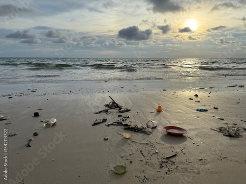 Plastic Trash and Pollution on Karon Beach, Phuket, Thailand at Sunset