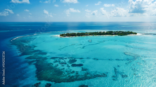 Seaplane view of coral reefs, sandbars, and clear lagoons in the Indian Ocean