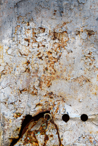 old post box on the wall of a building, old weathered paint