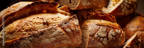 Macro view of dry flour and uneven surfaces on toasted bread crust highlighting natural rustic details, header banner