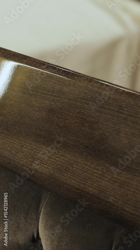 Vertical video. Elegant chair with wooden back emphasizing the decor. Close-up. Luxurious elegant room. Interior of a luxurious modern house.