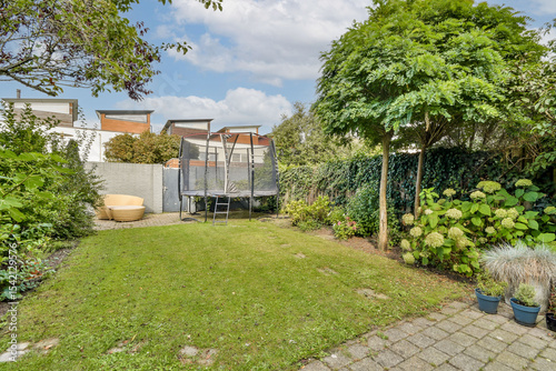 Wallpaper Mural Tranquil Backyard with Trampoline Torontodigital.ca