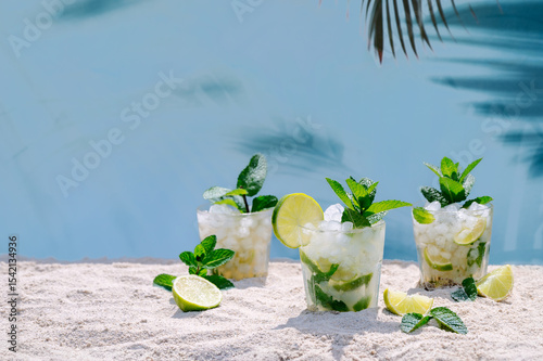 Refreshing mojito cocktails on a sandy beach