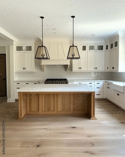 White kitchen with a light oak island