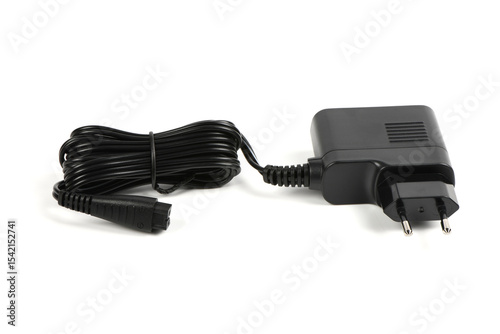 A black power supply. The wires are pulled together with a plastic-coated wire tie