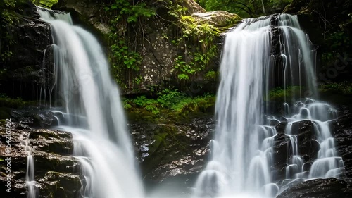 Beautiful waterfalls in a lush green forest paradise, ideal for nature and travel videos