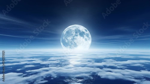 Majestic Full Moon Above Clouds Reflecting on Water Surface Under a Deep Blue Sky