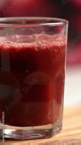Wallpaper Mural A glass of crimson juice: An appetizing close-up of a glass of ruby-red juice, its refreshing composition offers a look at culinary perfection, is captured through the lens.  Torontodigital.ca
