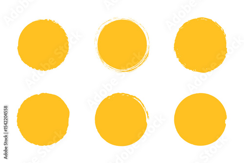 Yellow circle grunge shapes on a white background. Round brush painted circle brush stamps illustration of an orange and yellow