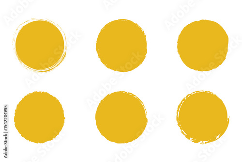 Yellow circle grunge shapes on a white background. Round brush painted circle brush stamps illustration of an orange and yellow
