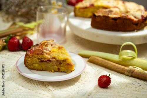Homemade strawberry rhubarb cake on a table setting