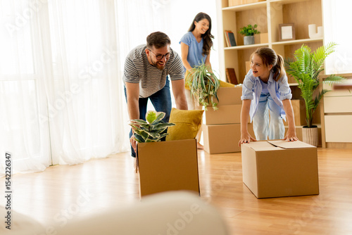 Family enjoys unpacking box...