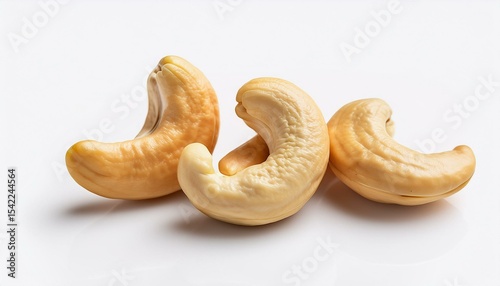 Three cashew nuts on white background